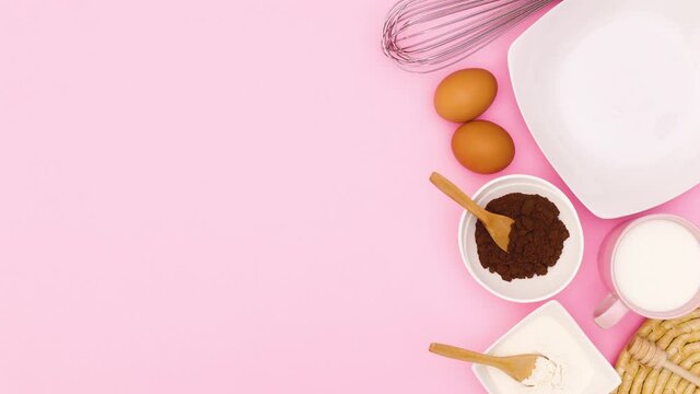 Baking items and cookies in plate appear on right side of pink theme. Stop motion 