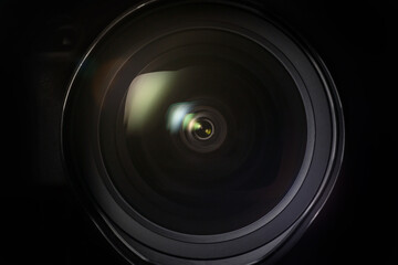 Beautyful camera lens close up on black background