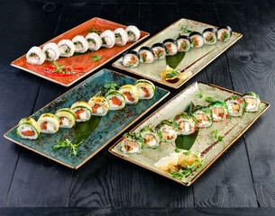 set of sushi rolls 4 plates