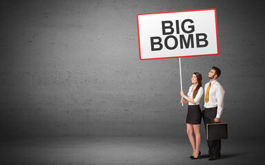 business person holding a traffic sign with BIG BOMB inscription, new idea concept