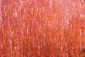 old metal background with a red tint