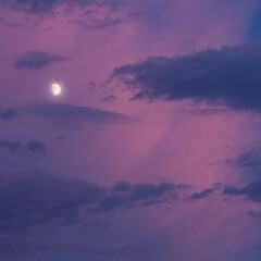 Square photo moon lit with blue and pink clouds
