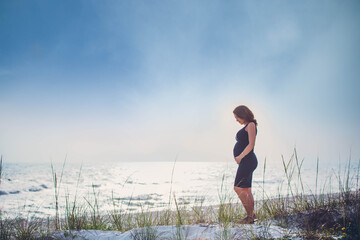 Fototapeta na wymiar pregnant woman in siesta Key beach