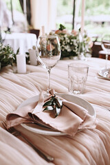 Beautiful table setting for wedding celebration in restaurant. Pink colours. Wedding decoration. 