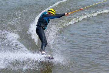 Man floating on a board on the water