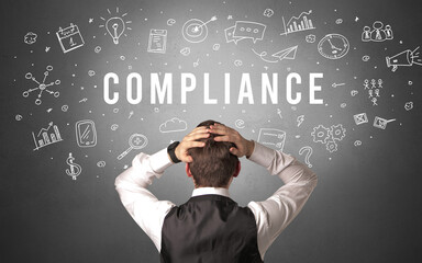 Rear view of a businessman with COMPLIANCE inscription, modern business concept