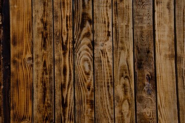 The texture of burnt wood. Pine wood background.