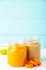 Assortment of vegetable and fruit puree on blue
