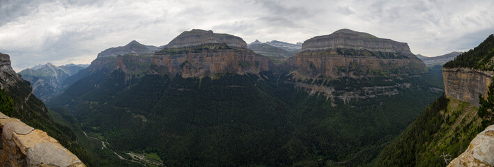 Ordesa Valley in the Pyrenees with mountains in the background.