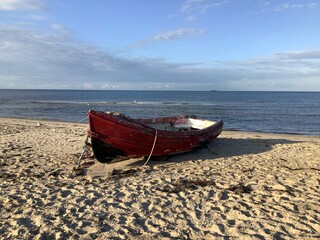 Vintage fishing boat on sandy beach of the Baltic Sea on the German island Usedom, Mecklenburg Vorpommern, Germany, Europe 