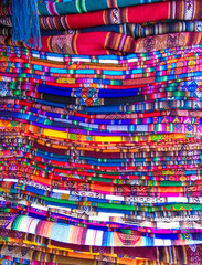 Macro-shot of typical colorful Bolivian handcrafted blankets and ponchos
