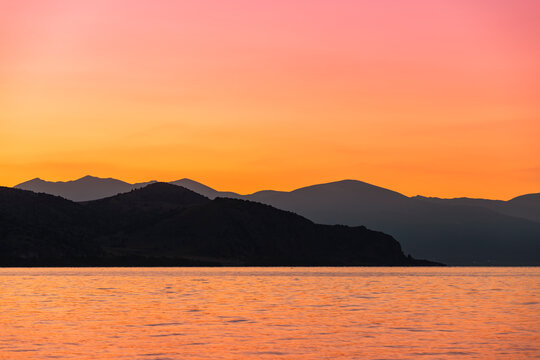 Beautiful sunrise landscape. The Mountains and lake early morning. Sevan National park Armenia.