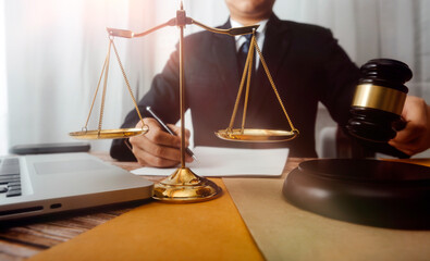 Business and lawyers discussing contract papers with brass scale on desk in office. Law, legal...
