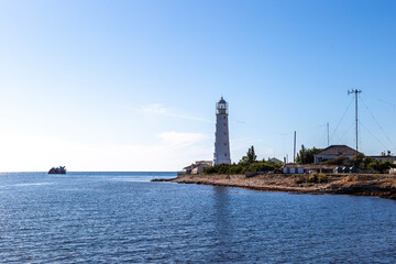 Fototapeta na wymiar Lighthouse at Cape Tarkhankut on a bright sunny day. Republic of Crimea.