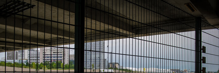 Fototapeta premium Fencing and bridge in an urban environment. Summer season. Basel. Switzerland.