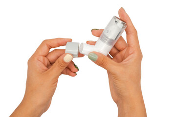 Asthma inhaler in the girl's hands on a white background