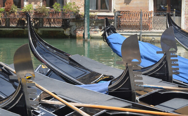 
Venetian foreshortening with resting gondolas in a typical canal