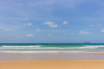 Empty tropical beach on sunny day. Duli beach in Palawan, Philippines. Surf beach. Wide beach with island on background. Travel in Asia. Tropical landscape. Azure water in idyllic lagoon. 