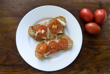 sandwiches on ciabatta toast with fresh vegetables, tomatoes, microgreens on wood background. Close up. Copy space.