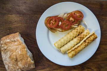 sandwiches on ciabatta toast with fresh vegetables, tomatoes, microgreens on wood background. Close up. Copy space.