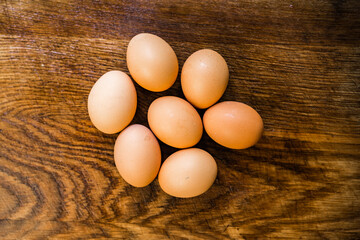 Organic brown eggs on a wooden table. Easter concept.