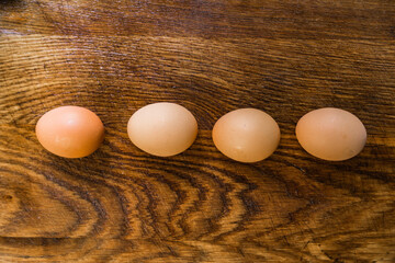 Organic brown eggs on a wooden table. Easter concept.