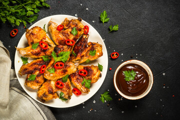 Grilled chicken wings at black.