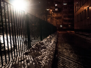 paved path by the light of a lantern at night in winter, Moscow
