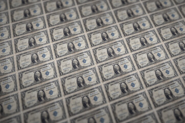 1 US dollar bills printed in illegal money production conveyor. Collage of many fake bills. Concept...