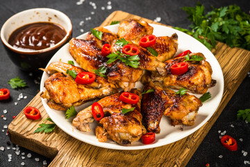 Grilled chicken wings with barbecue sauce.