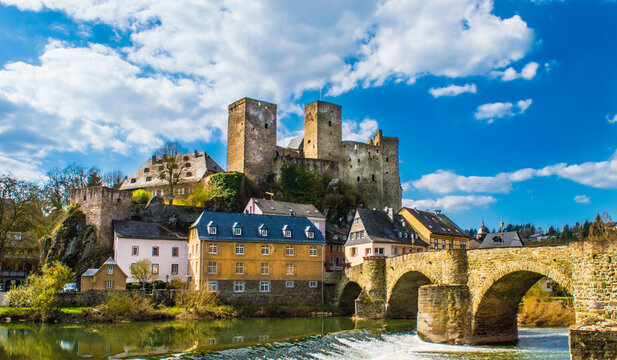 runkel castle in germany with a stone bridge in the foreground