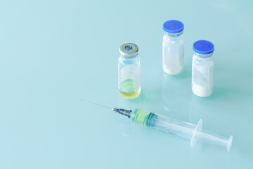 medical syringe and vials with vaccine, medicine