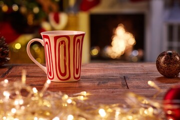 Christmas still life with mug and fireplace - cosy winter time. 