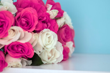 
Beautiful bouquet of roses with gifts and cafe.On a white background a beautiful bouquet of colorful roses.