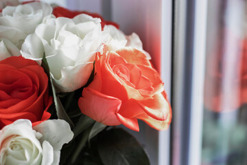 
Beautiful bouquet of roses with gifts and cafe.On a white background a beautiful bouquet of colorful roses.