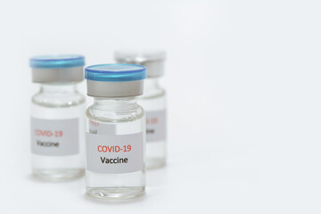 Vaccine COVID-19 (Coronavirus) in glass bottle on white