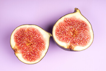 Figs isolated on black background. Half a fig. Healthy food concept.