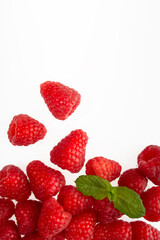 Raspberries arranged on a white background.