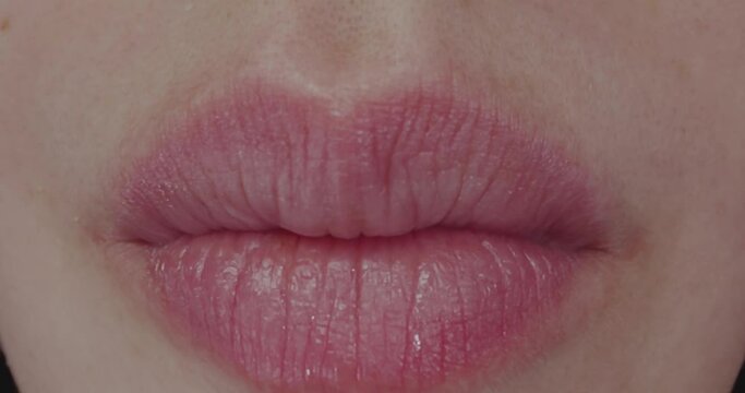 Macro. Eating Girl with Braces. Lips