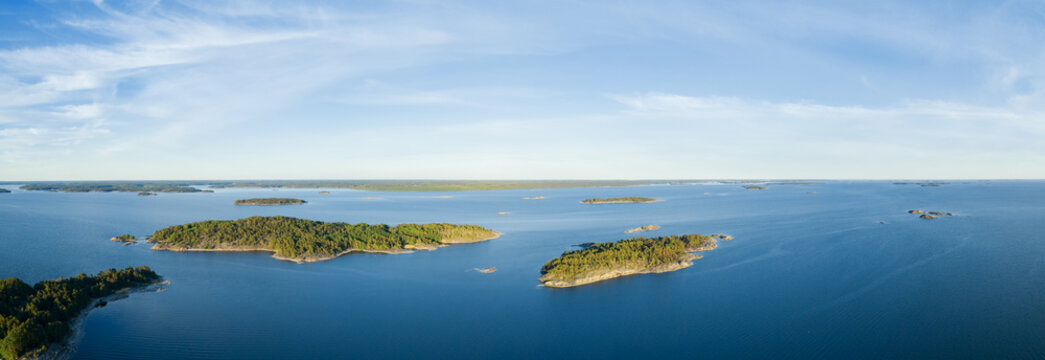 Aerial panoramic view over beautiful islands on the baltic sea in Finland. Blue sky. Top view. Saaristomeri.