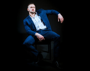 Confident handsome business man in suit. Fashion male model. Portrait of a handsome guy in shirt.