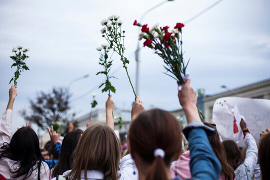 Minsk .Belarus.29.08.2020:revolution in Belarus.women's protest against violence.peaceful demonstrators with flags  flowers and posters on the streets of Minsk