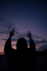 Silhouette of young woman in a landscape 