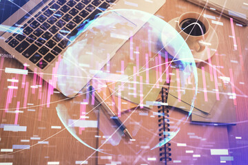 Stock market graph and top view computer on the table background. Double exposure. Concept of financial education.