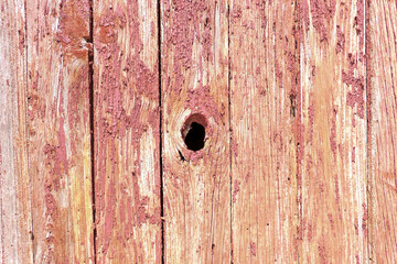 old barn wall with a knot hole