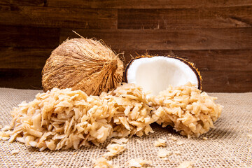 Cocada on the wooden table. Traditional coconut sweet from Brazil.