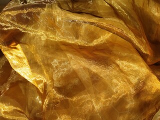Organza is yellow-brown with a beige sheen. Shiny, reflective, beautiful fabric for curtains,...
