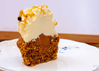 Carrot cupcakes with mascarpone cream and grated walnuts