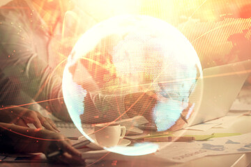 Obraz premium Double exposure of man and woman working together and financial theme hologram. international business concept. Computer background.