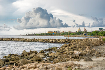 Fototapeta na wymiar coastal seascape with big clouds against the walled city in Cartagena de Indias Coolombia